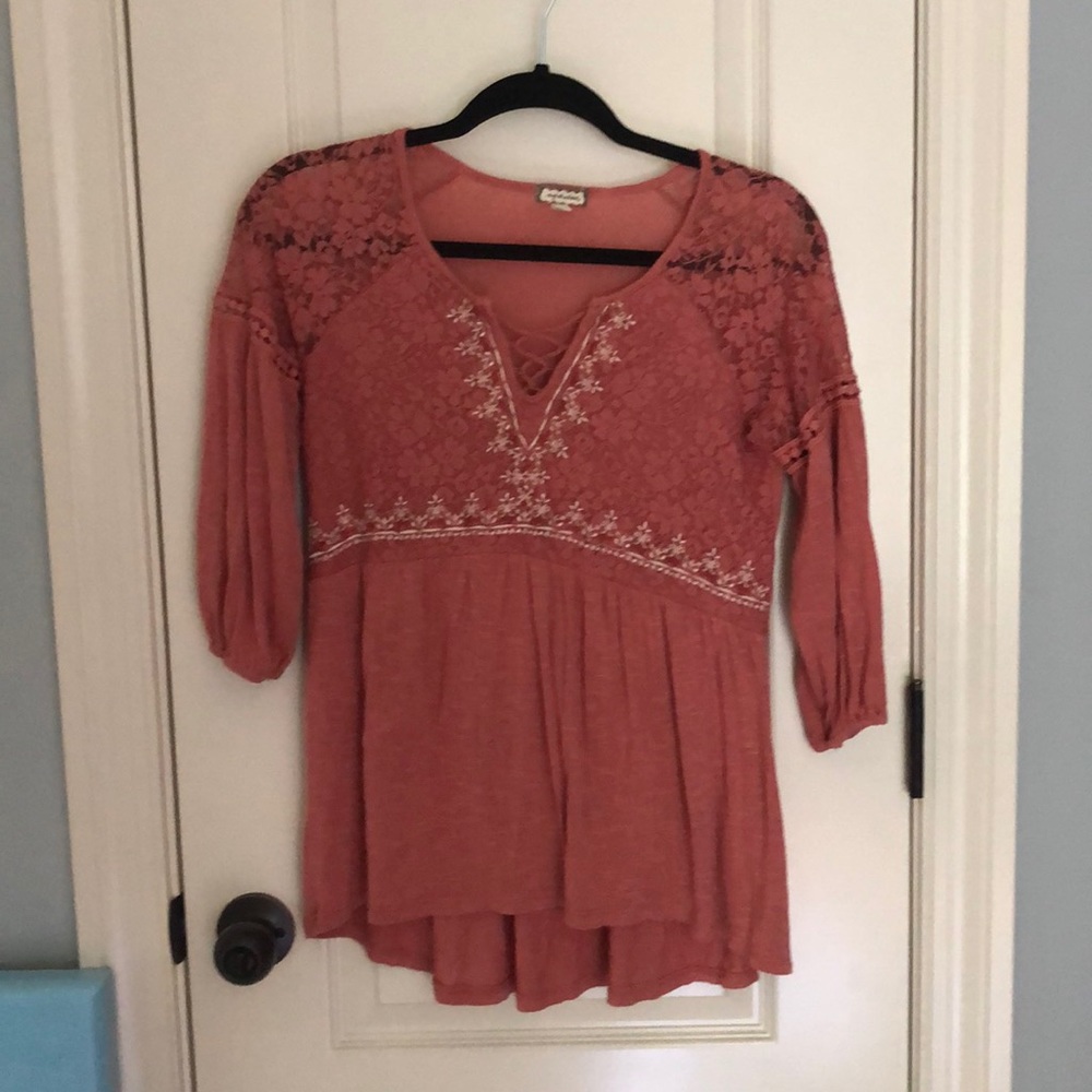 pretty dusty rose colored top with floral details.